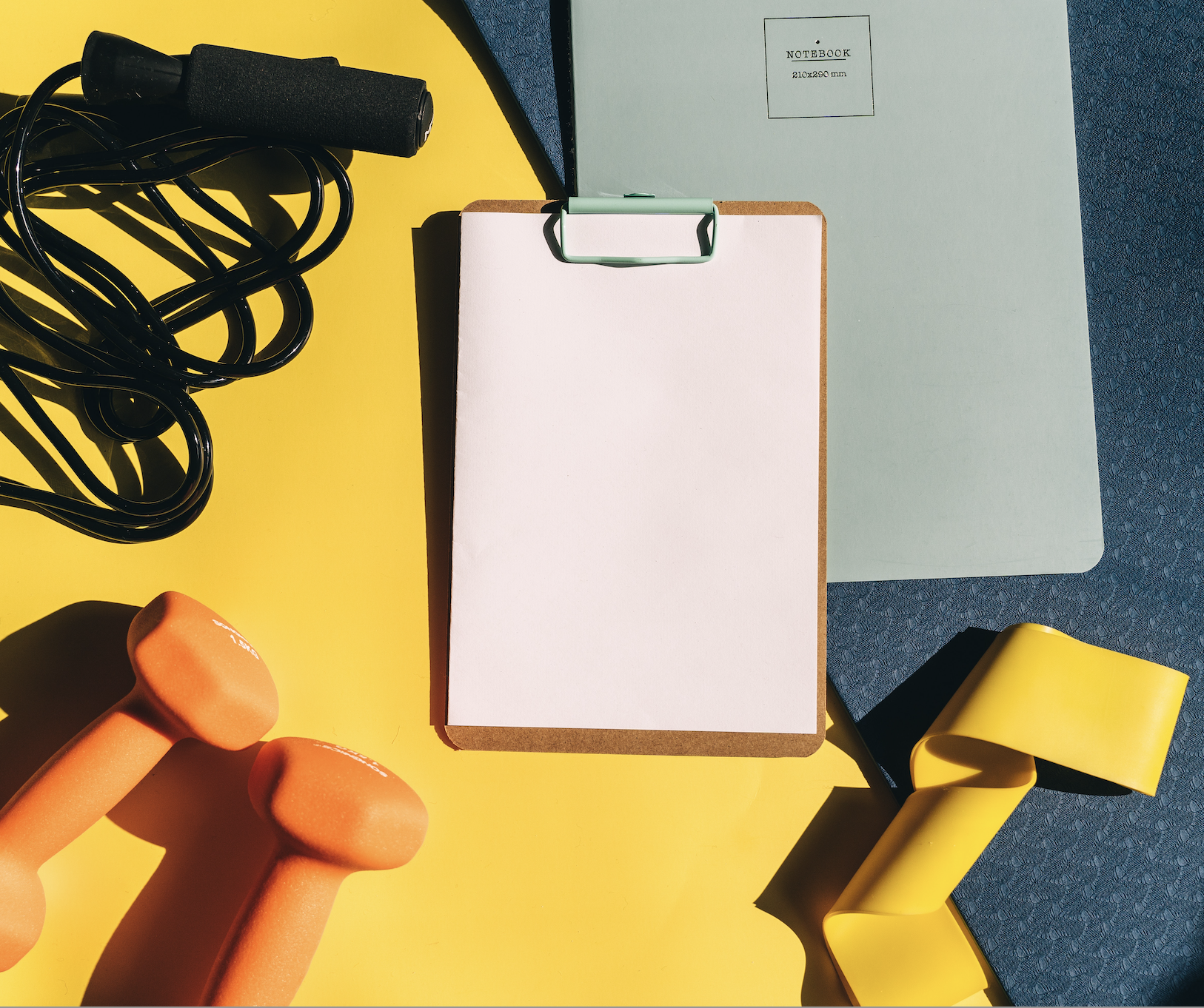 Writing down a workout log in a journal